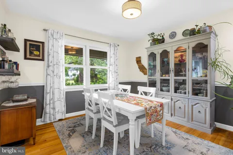 a view of a dining room with furniture and window