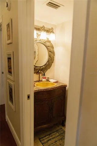 a bathroom with a sink and a mirror