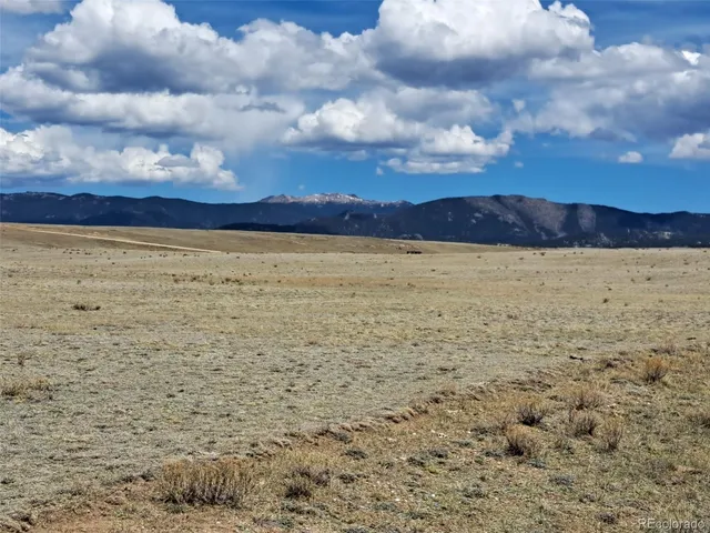 a view of mountain with lake view
