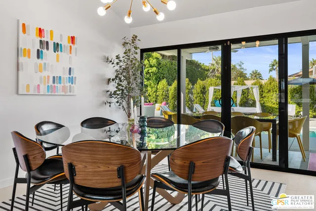 a kitchen with a refrigerator sink and wooden cabinets