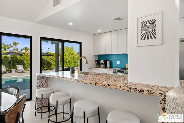 a bathroom with sink and mirror