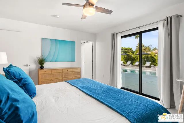 a view of swimming pool with seating area