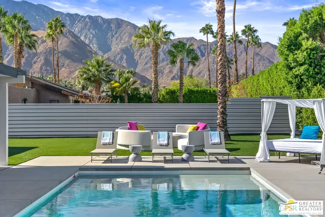 a view of a swimming pool with a patio
