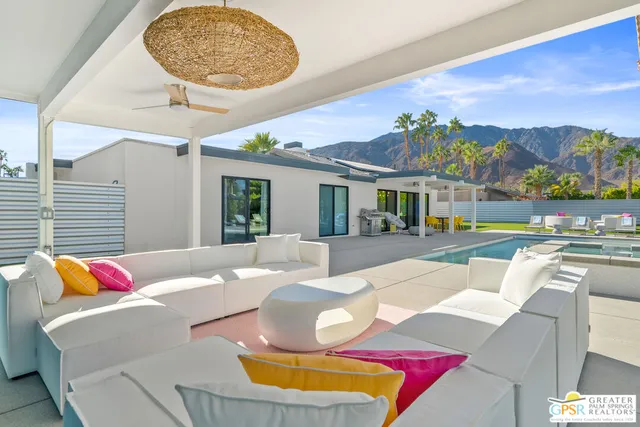 a view of a swimming pool with a patio