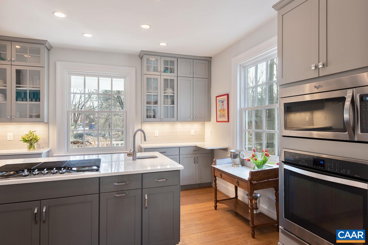 1946 Thomson Road Charlottesville, VA 22903 - Photo 8 of 47 a kitchen with stainless steel appliances a stove a sink and a microwave