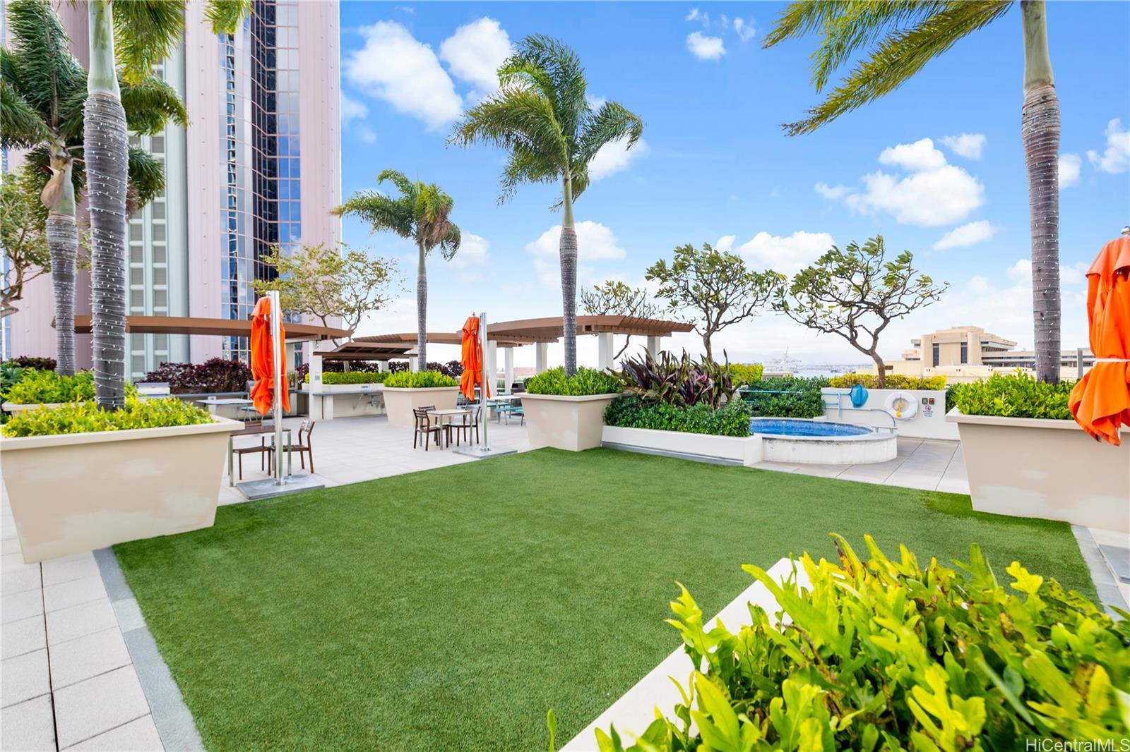 555 South Street, Unit 1805 Honolulu, HI 96813 - Photo 13 of 20 a view of a swimming pool with a table and chairs in patio