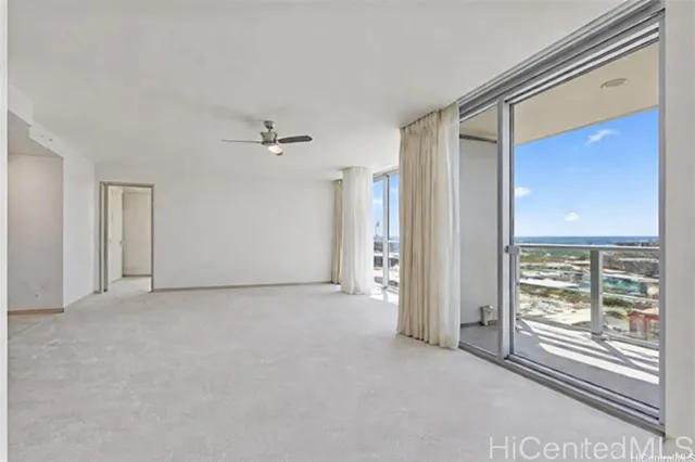 a view of an empty room with a window