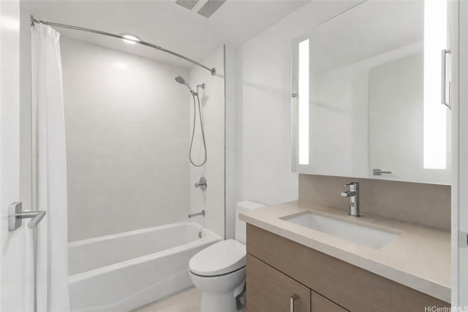 555 South Street, Unit 1805 Honolulu, HI 96813 - Photo 8 of 20 a bathroom with a sink a toilet and shower