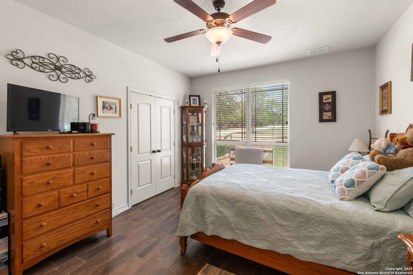 1446 Big Draw Drive Junction, TX 76849 - Photo 13 of 55 a bedroom with a bed and a flat screen tv
