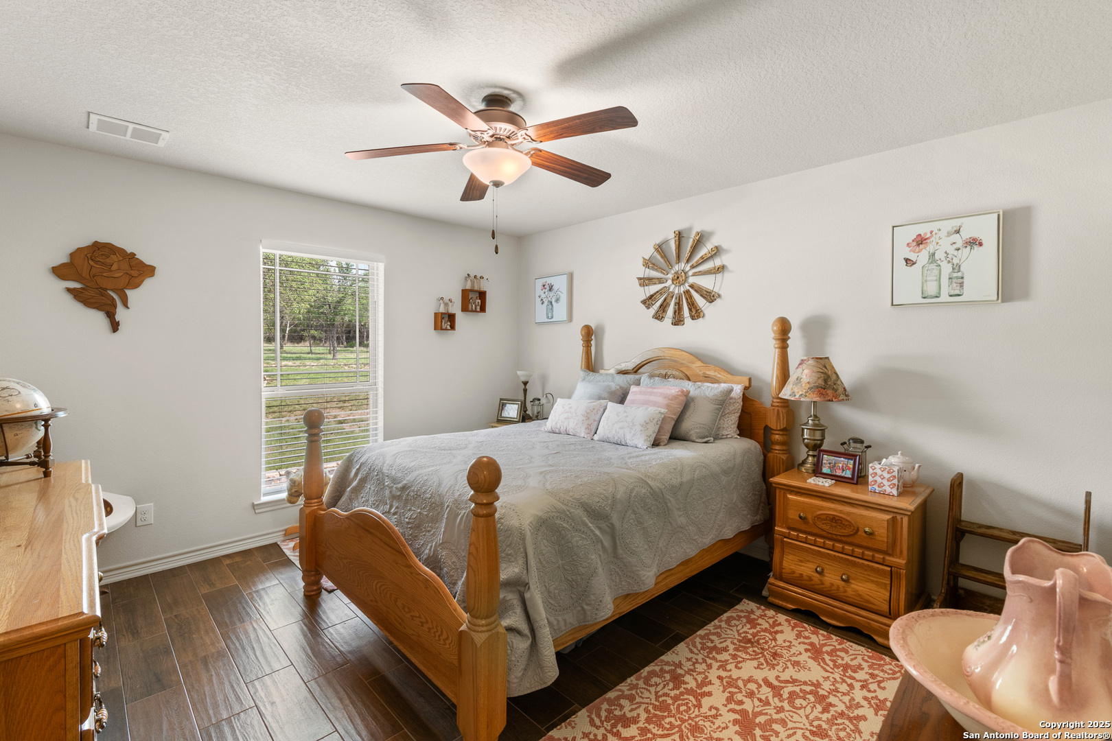 1446 Big Draw Drive Junction, TX 76849 - Photo 14 of 55 a bedroom with a bed and wooden floor