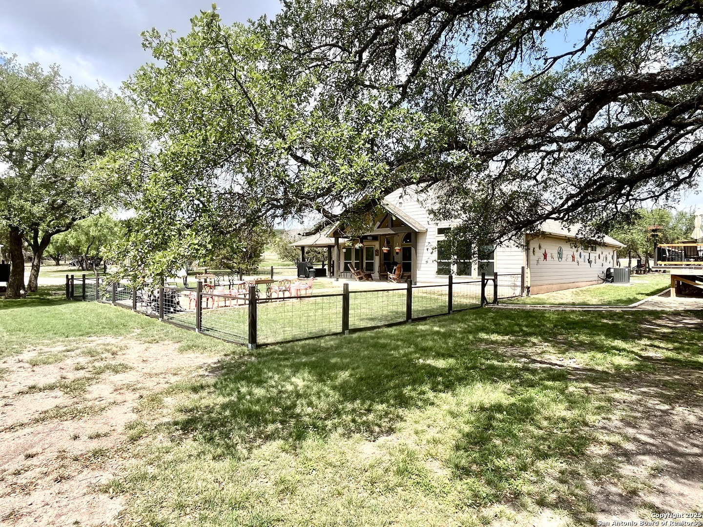 1446 Big Draw Drive Junction, TX 76849 - Photo 20 of 55 a sign board in front of a white house