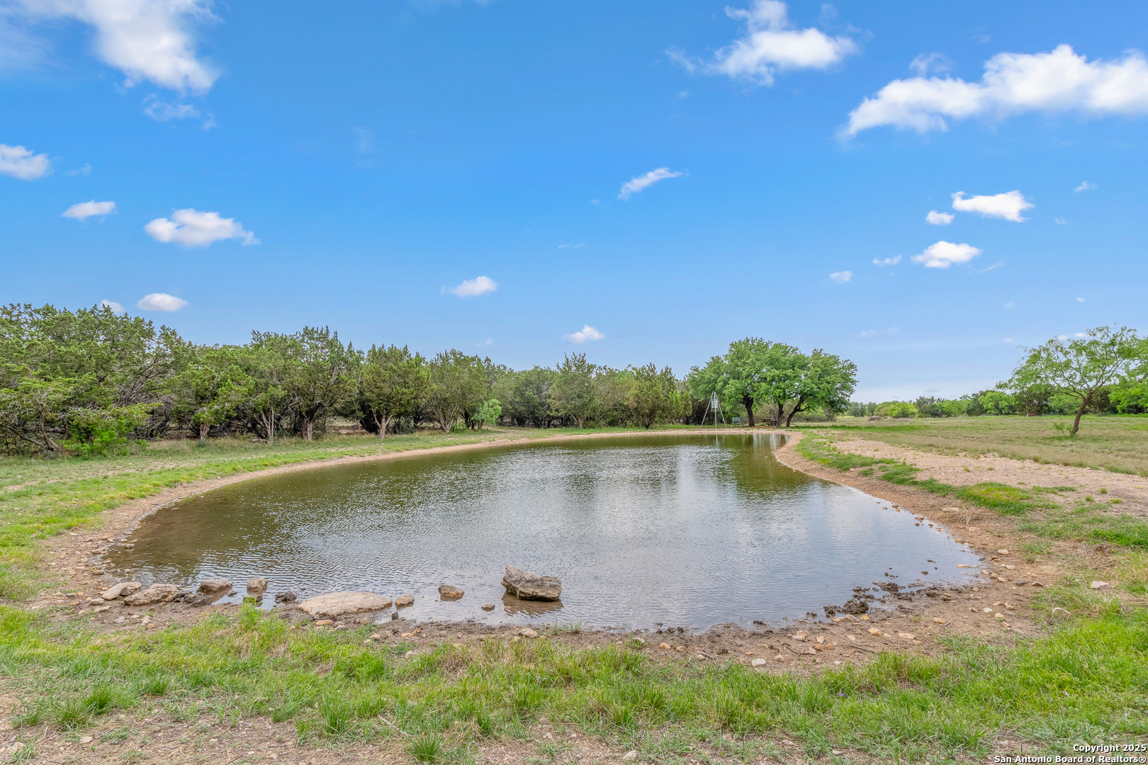 1446 Big Draw Drive Junction, TX 76849 - Photo 21 of 55 a view of a lake with houses in the back
