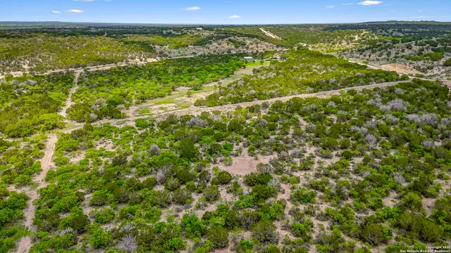 a view of a lush green space with sea