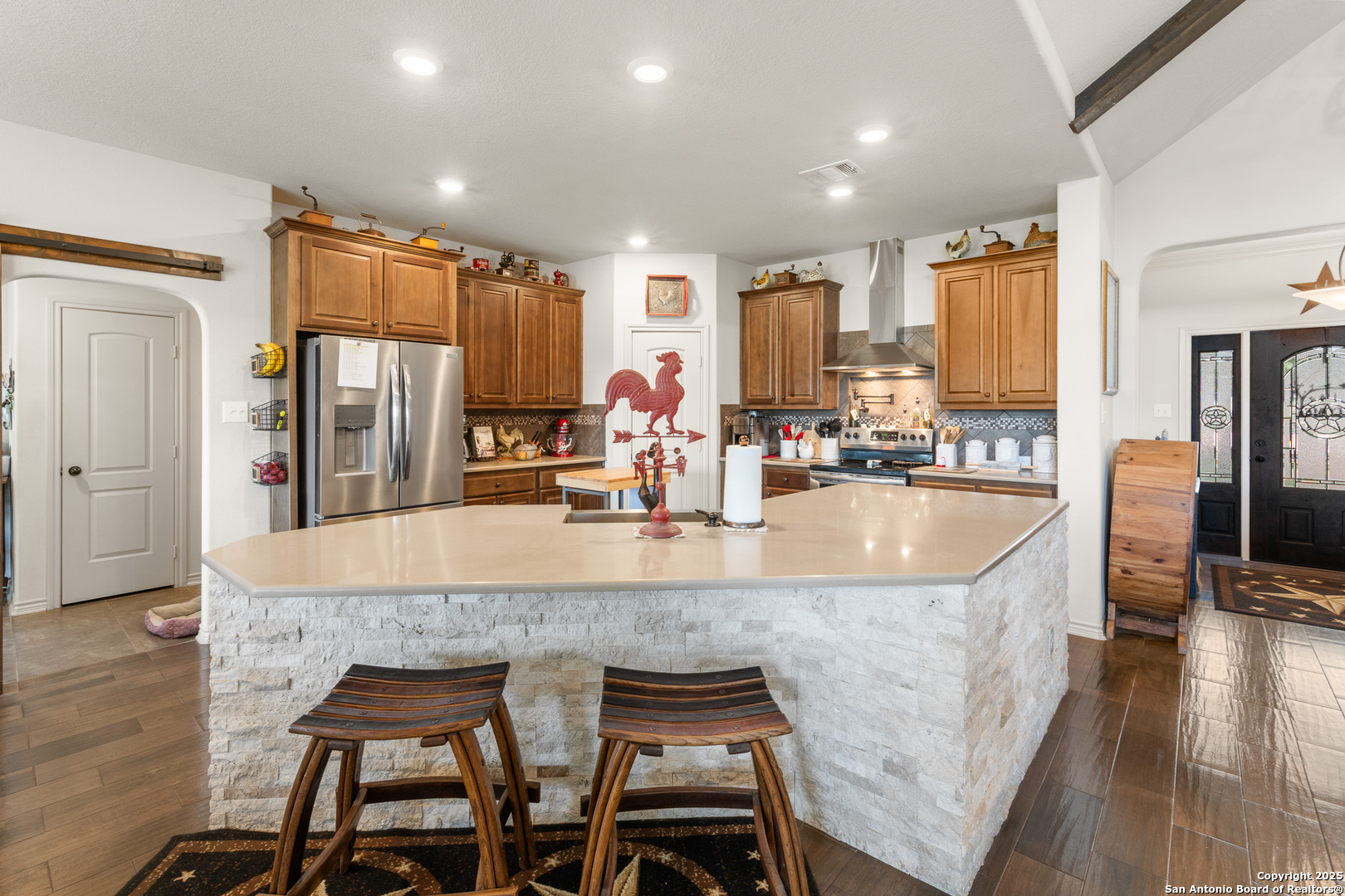 1446 Big Draw Drive Junction, TX 76849 - Photo 6 of 55 a kitchen with granite countertop sink and refrigerator