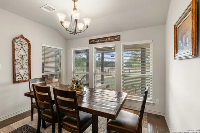 a view of a dining room with furniture window and outside view