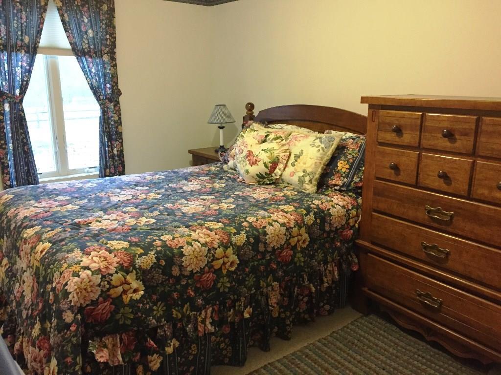 170 Kelleytown Road Bernard, ME 04612 - Photo 32 of 33 A floral guest room