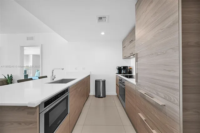 a bedroom with a large bed and a large window