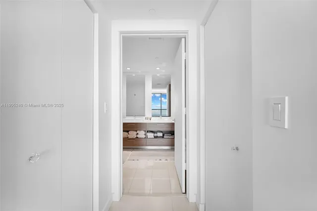 a bathroom with a double vanity sink toilet and shower