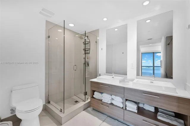 a view of a room with balcony and floor to ceiling window