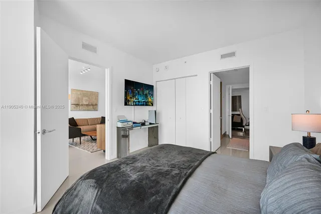 a bathroom with a shower and a glass door