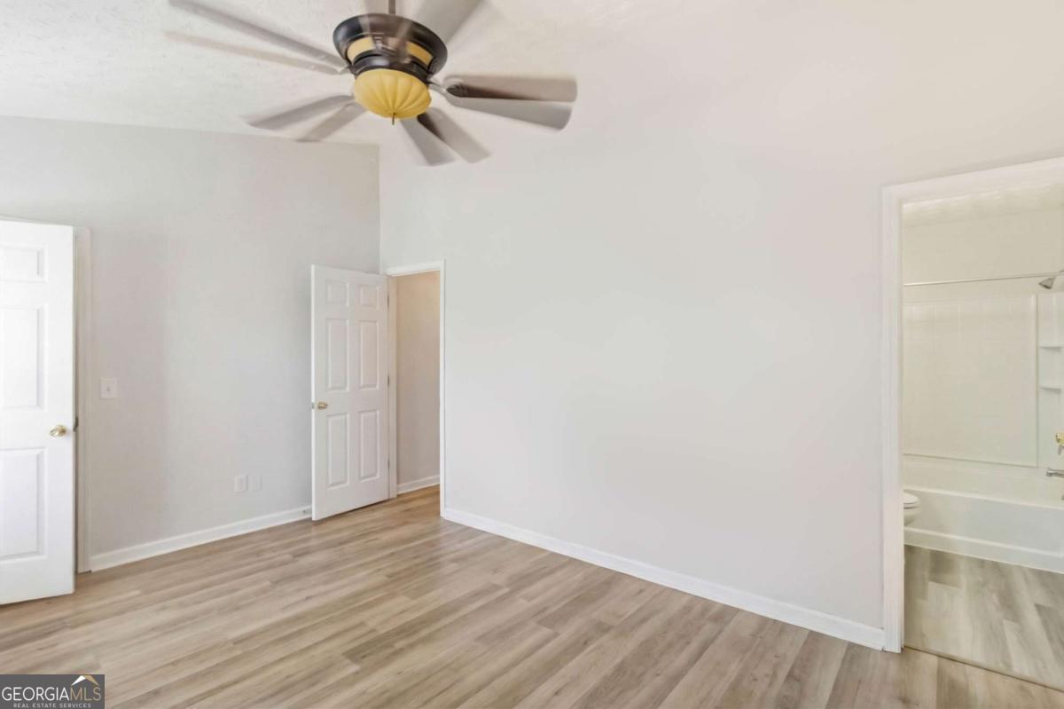 5559 Strathmoor Manor Circle Lithonia, GA 30058 - Photo 17 of 22 a view of entryway with wooden floor