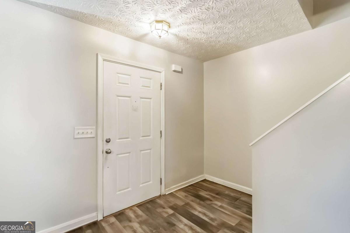 5559 Strathmoor Manor Circle Lithonia, GA 30058 - Photo 2 of 22 a view of an empty room