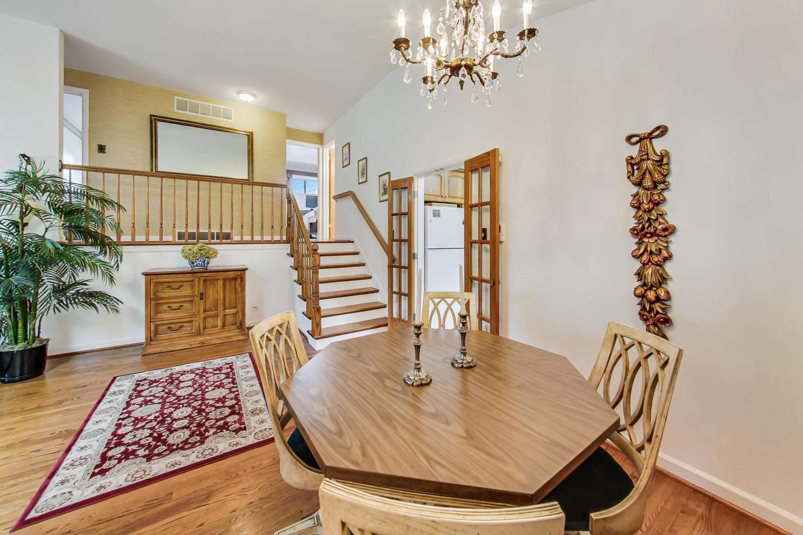 322 Voltz Road Northbrook, IL 60062 - Photo 5 of 21 a view of a dining room with furniture and wooden floor