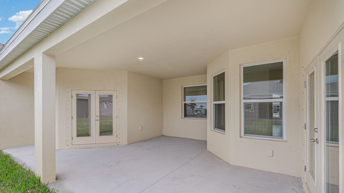 83 52nd Square Vero Beach, FL 32968 - Photo 19 of 21 front view of a house with a glass door