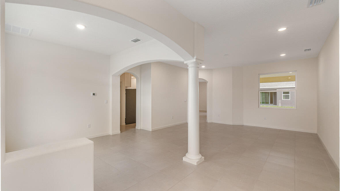 83 52nd Square Vero Beach, FL 32968 - Photo 2 of 21 an empty room with windows and closet