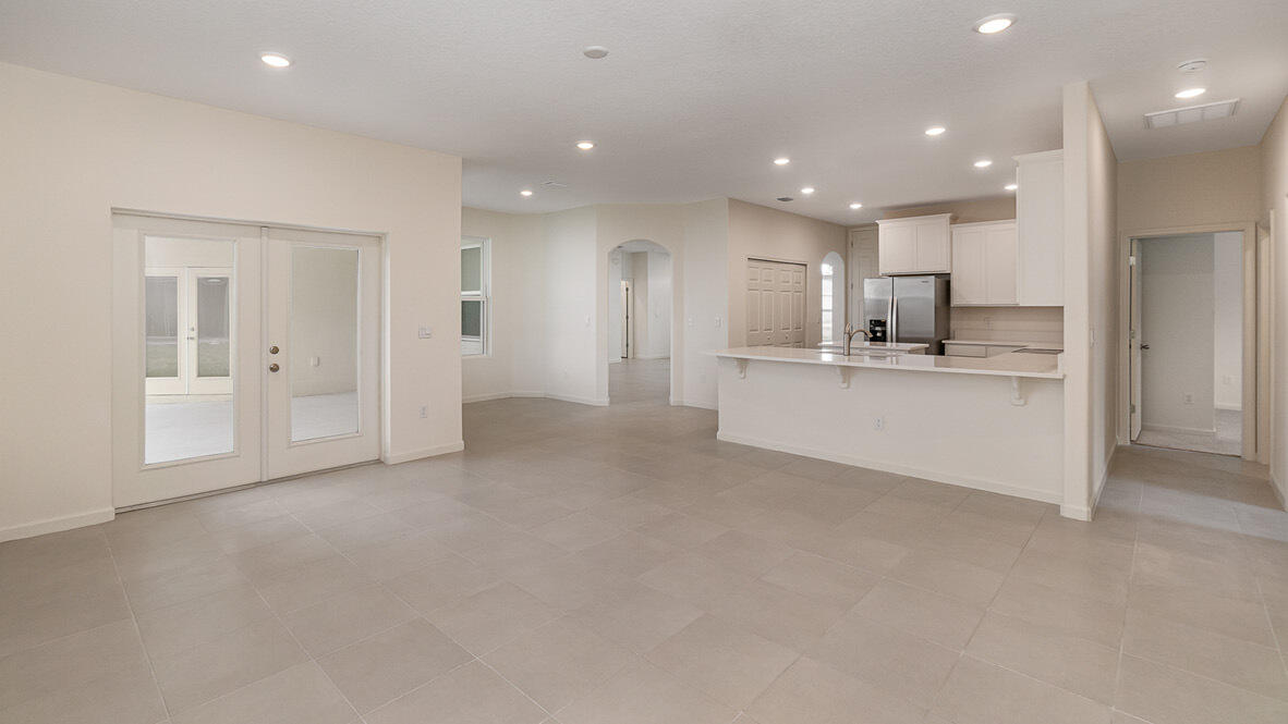 83 52nd Square Vero Beach, FL 32968 - Photo 7 of 21 a view of a kitchen with refrigerator and a sink