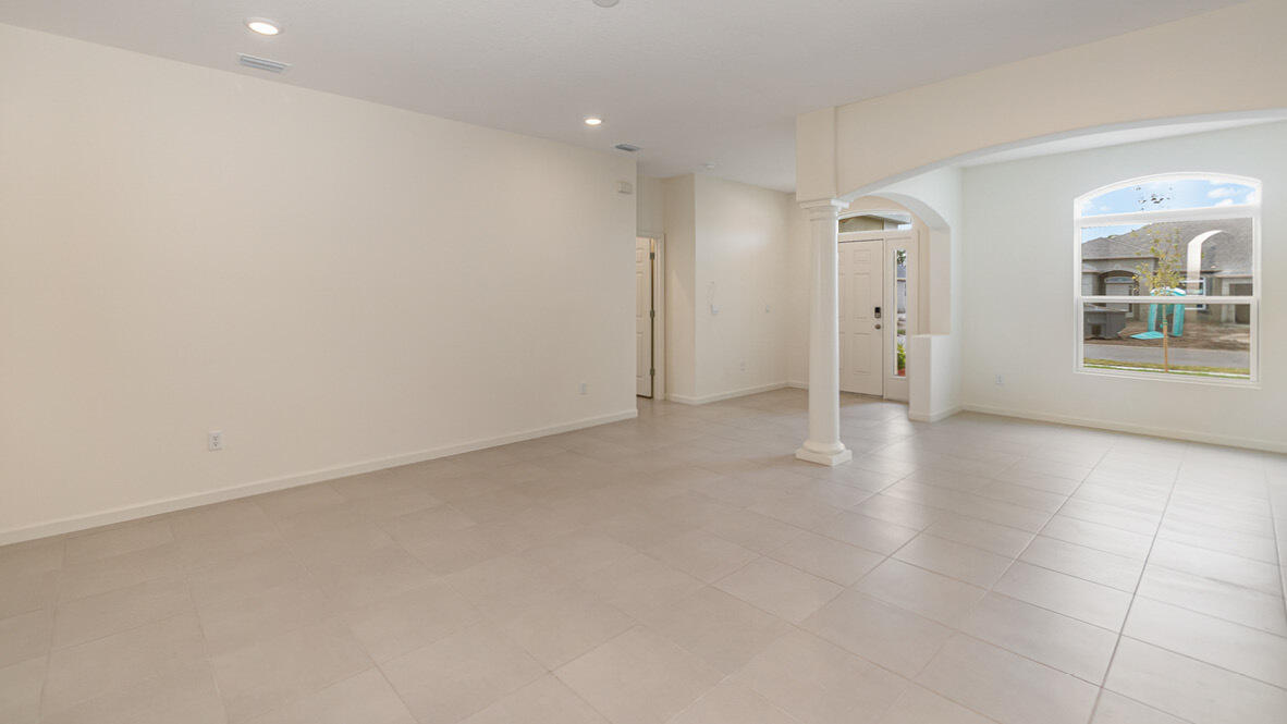 83 52nd Square Vero Beach, FL 32968 - Photo 9 of 21 a view of an empty room with a window