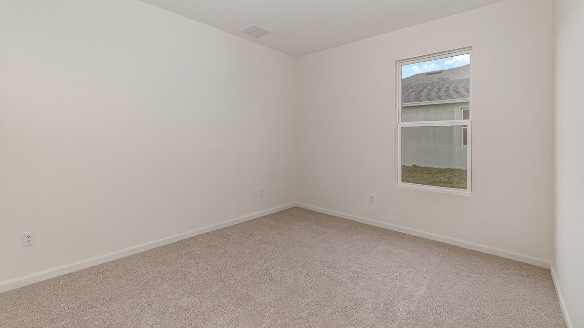 83 52nd Square Vero Beach, FL 32968 - Photo 10 of 21 an empty room with a window