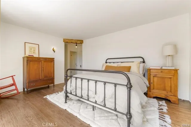 a bedroom with a large bed and a large window