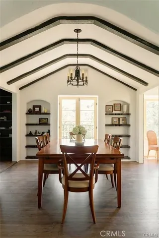 a view of a workspace with furniture window and wooden floor