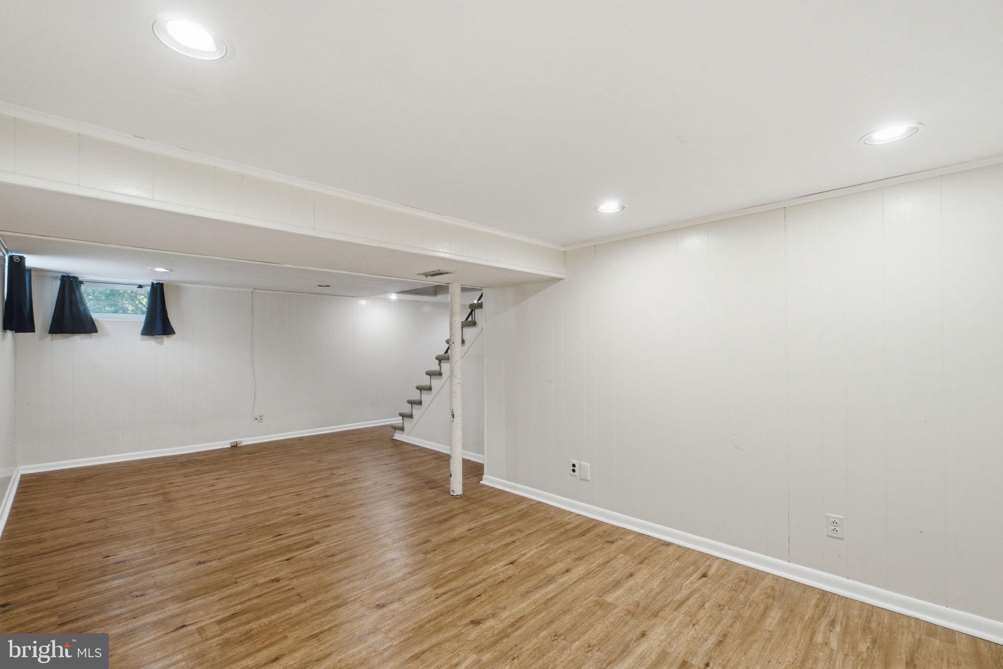107 Oakway Road Lutherville-Timonium, MD 21093 - Photo 37 of 52 Basement rec room with access to a half bath