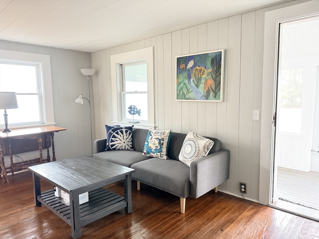 43 Pond Street, Unit 11 Dennis, MA 02670 - Photo 11 of 37 a living room with furniture and wooden floor