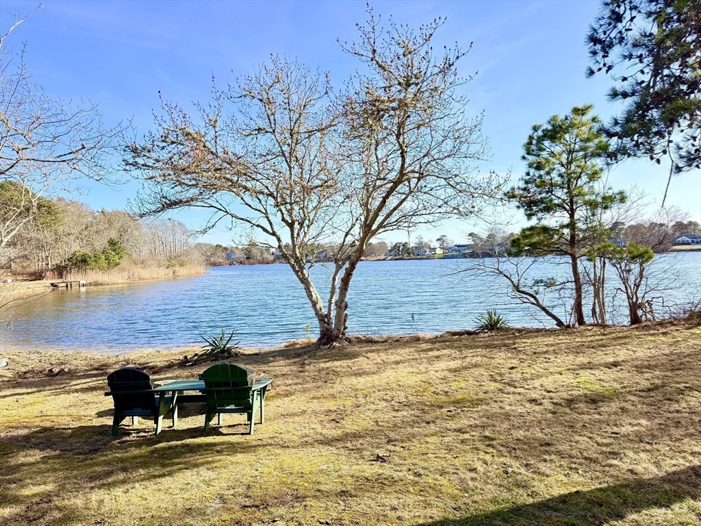43 Pond Street, Unit 11 Dennis, MA 02670 - Photo 13 of 37 a view of a lake with a mountain