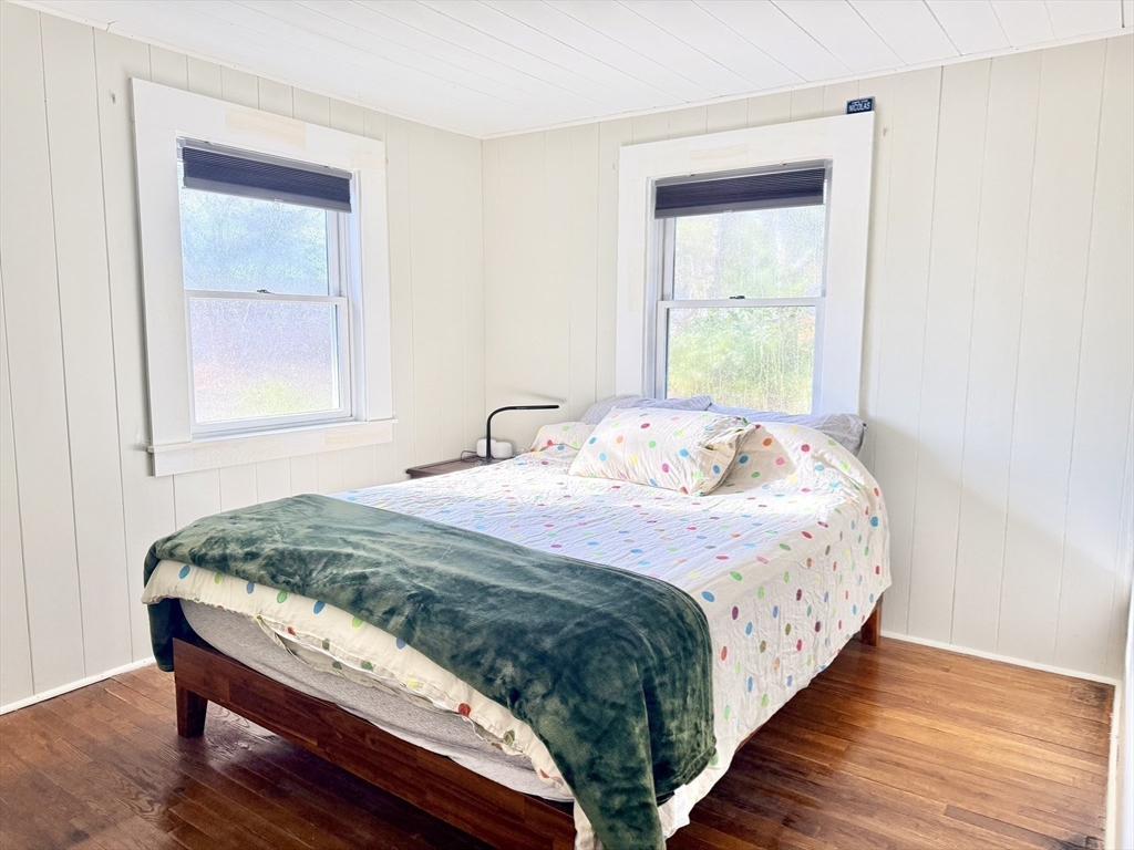 43 Pond Street, Unit 11 Dennis, MA 02670 - Photo 20 of 37 a bedroom with a bed and a window