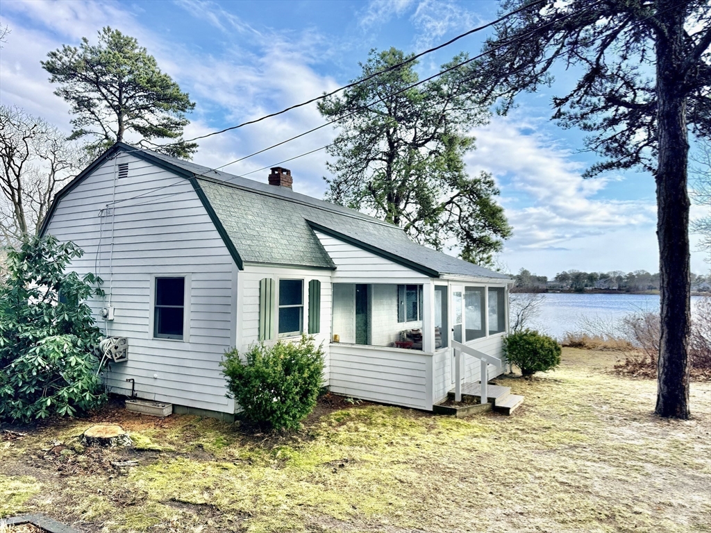 43 Pond Street, Unit 11 Dennis, MA 02670 - Photo 26 of 37 a view of a house with a yard