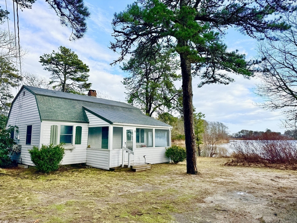 43 Pond Street, Unit 11 Dennis, MA 02670 - Photo 27 of 37 a view of a house with a yard