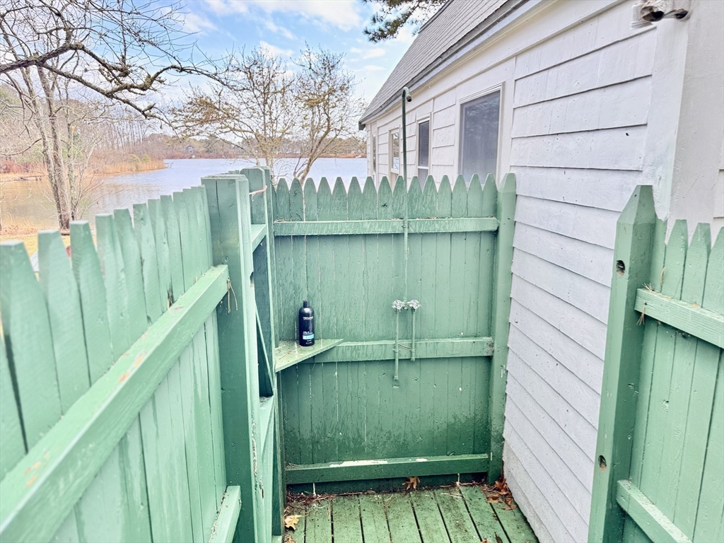 43 Pond Street, Unit 11 Dennis, MA 02670 - Photo 34 of 37 a view of front door and small lake