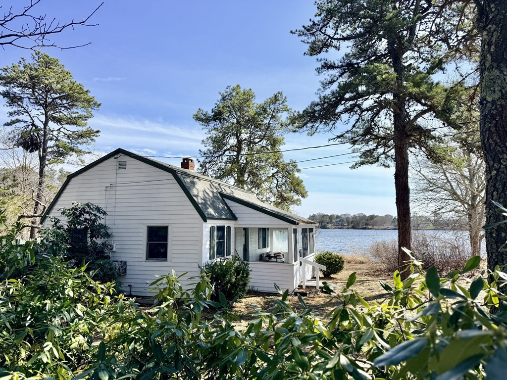 43 Pond Street, Unit 11 Dennis, MA 02670 - Photo 4 of 37 a view of a house with wooden floor and a tree