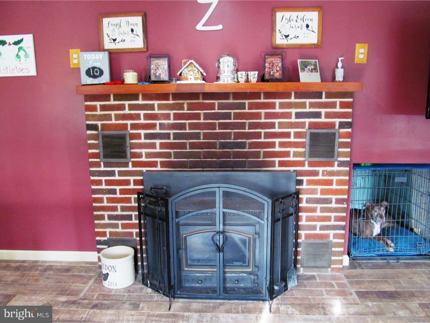 859 Kulp Road Perkiomenville, PA 18074 - Photo 11 of 24 Masonry fireplace w wood stove insert with blower