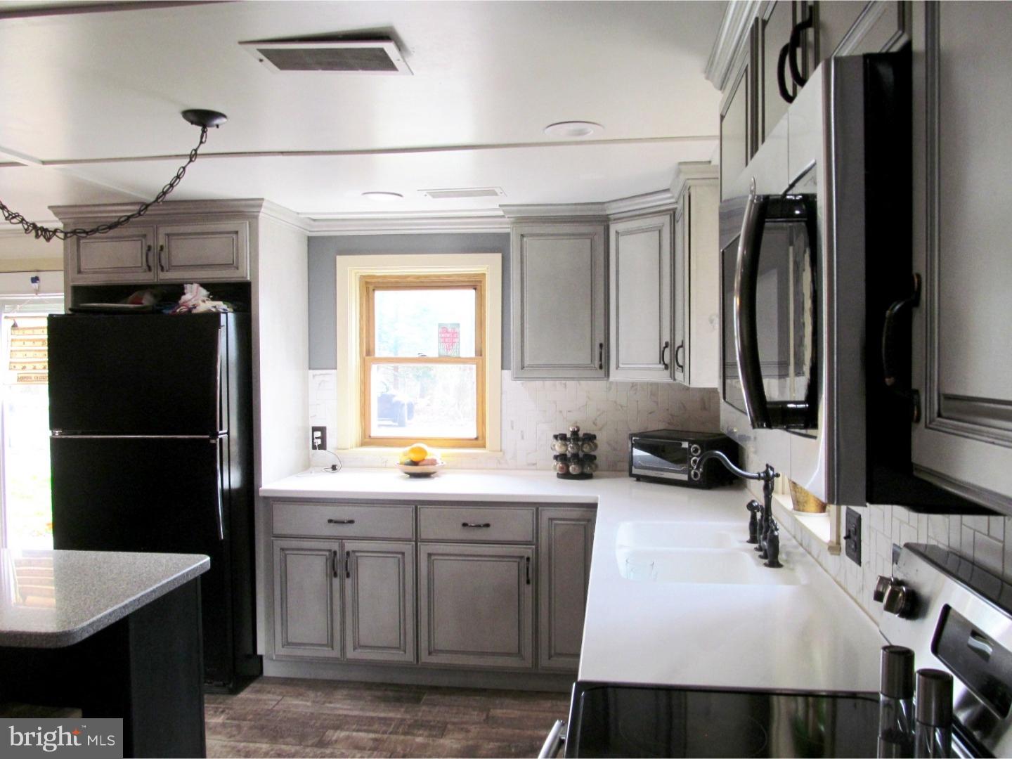 859 Kulp Road Perkiomenville, PA 18074 - Photo 7 of 24 Kitchen has corian countertops and stainless too.