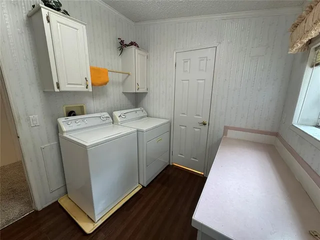 a utility room with sink dryer and washer