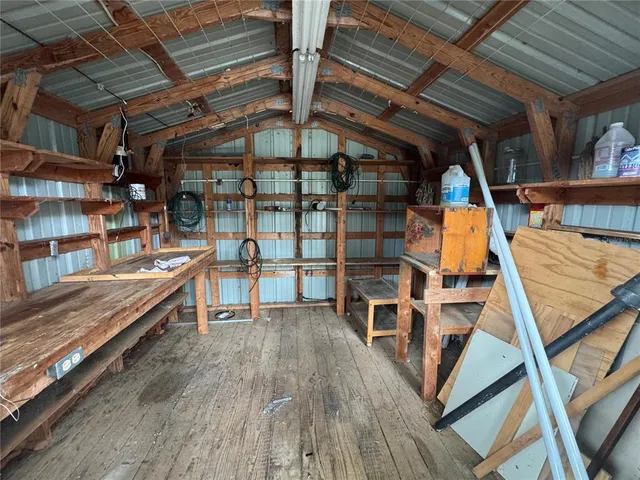 a view of deck with wooden floor and iron stairs