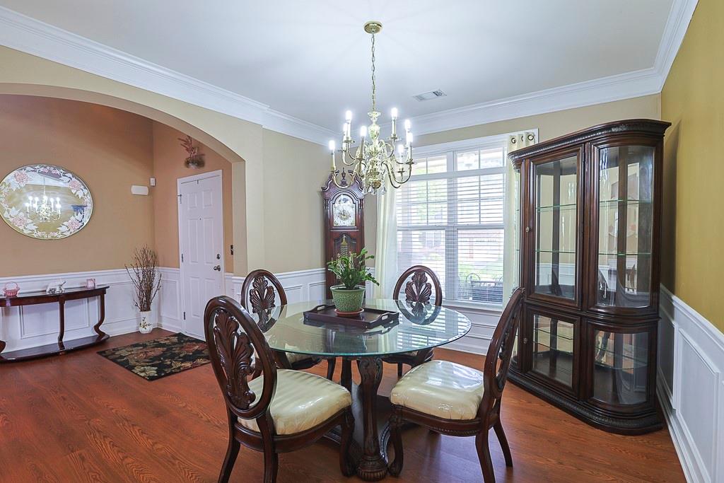 300 Hampton Place Canton, GA 30115 - Photo 11 of 82 a view of a dining room with furniture window and wooden floor