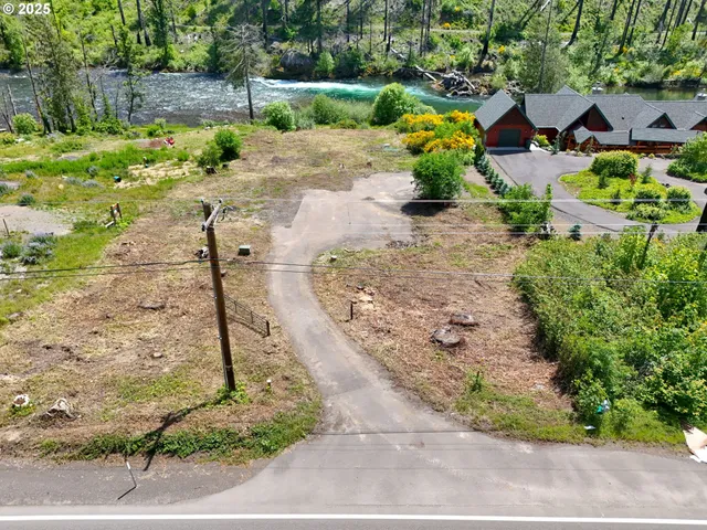 a backyard of a house with a yard and outdoor seating