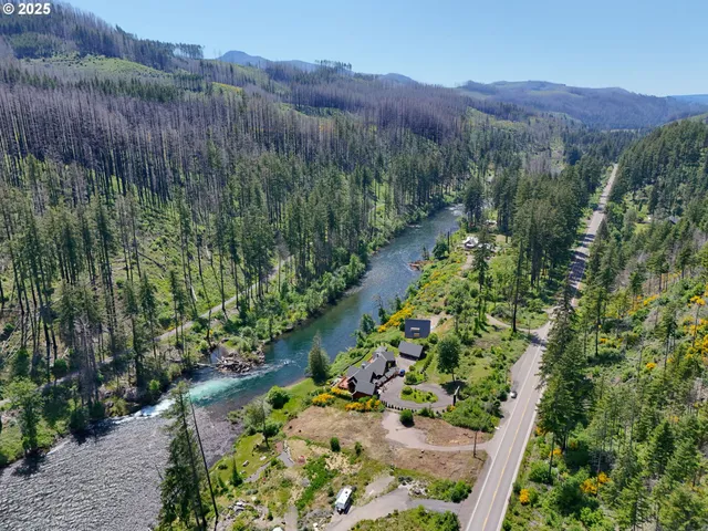 a view of a lush green hillside and a building