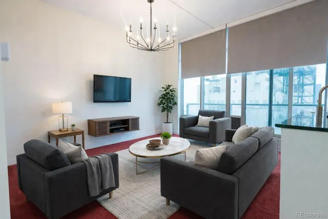 a living room with fireplace furniture and a flat screen tv